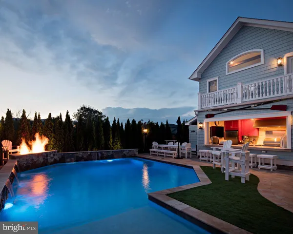 a view of swimming pool with outdoor seating