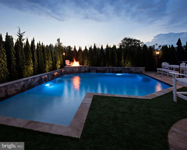 a view of swimming pool having outdoor seating