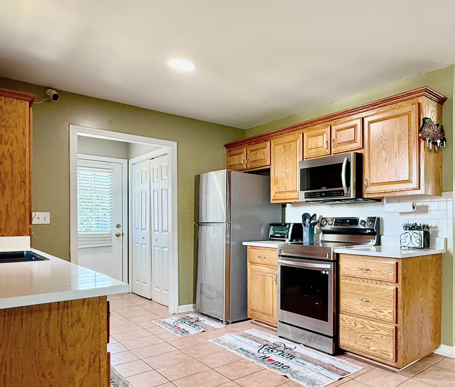 2801 Faith Lane Spring Hill, TN 37174 - Photo 5 of 10 a kitchen with stainless steel appliances granite countertop a stove a refrigerator and a sink
