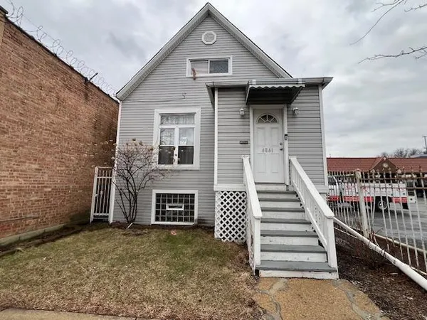 a front view of a house with stairs