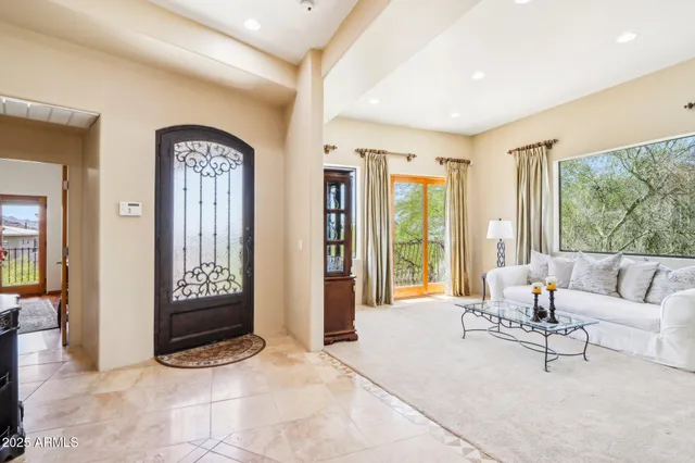 a view of staircase with white walls and glass door