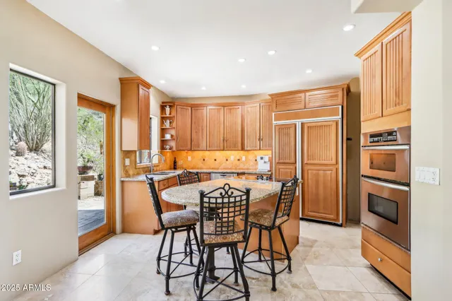 a view of a dining room with furniture window and outside view