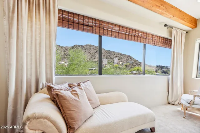 a view of walk in closet with clothes