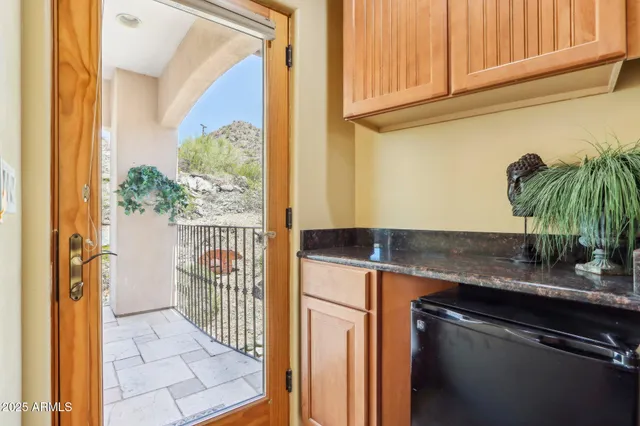 a view of a balcony with wooden fence