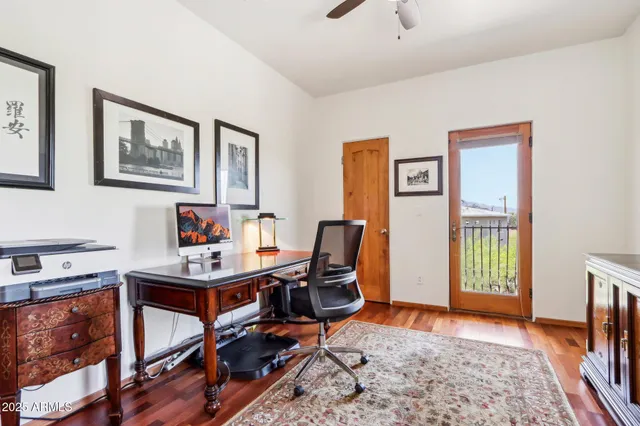 a bathroom with a granite countertop sink mirror vanity and toilet
