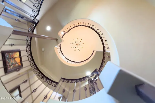 a view of a house with a garden and sitting area