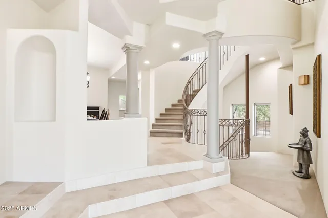 a picture of a bench in front of a wall