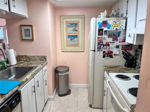 a kitchen with a stove and a sink