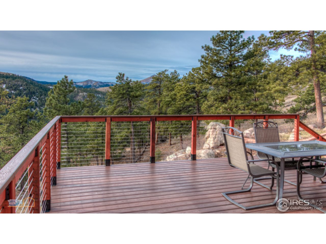 1385 West Coach Road Boulder, CO 80302 - Photo 3 of 25 a balcony with table and chairs