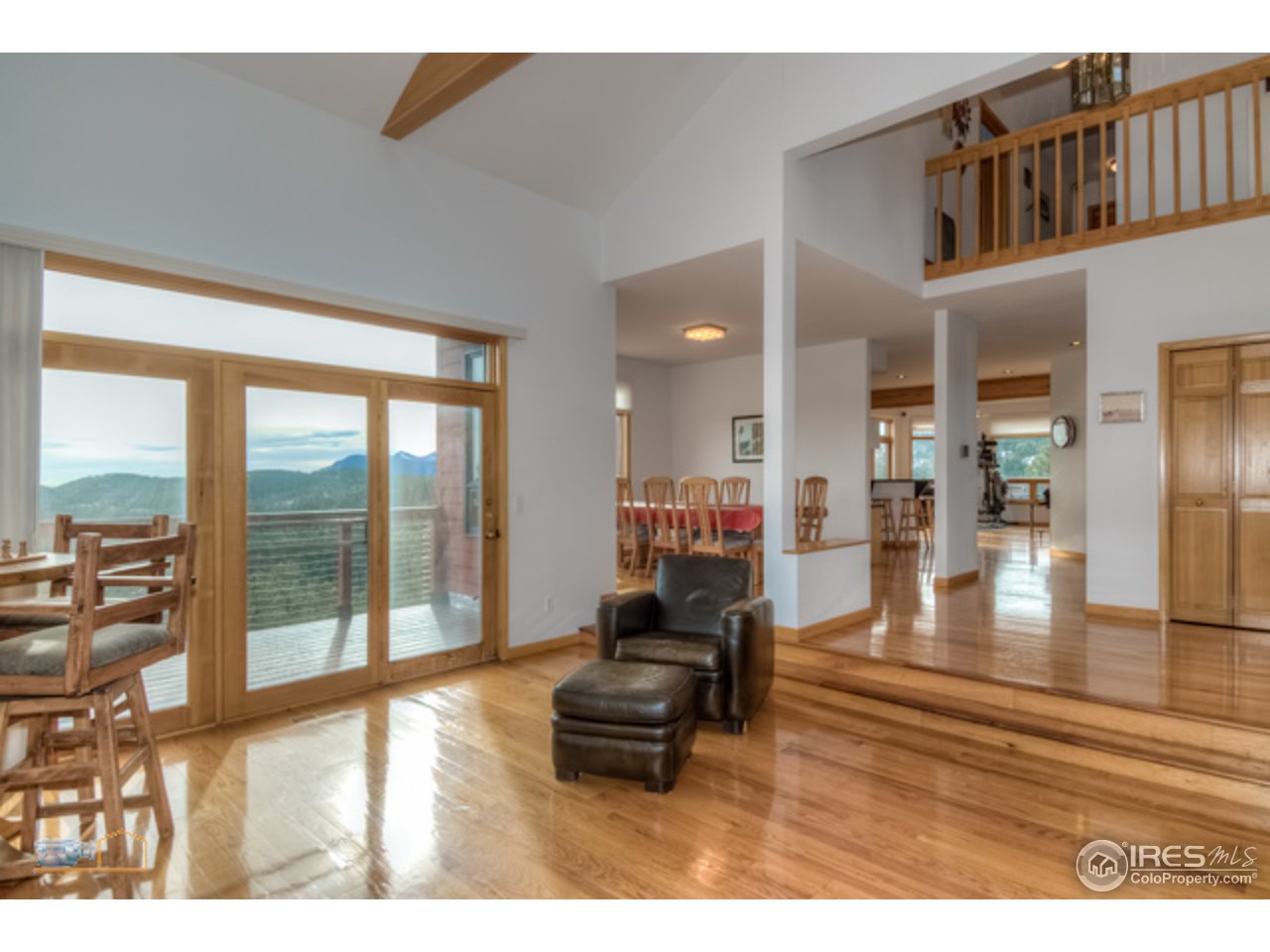 1385 West Coach Road Boulder, CO 80302 - Photo 4 of 25 a living room with furniture and a floor to ceiling window