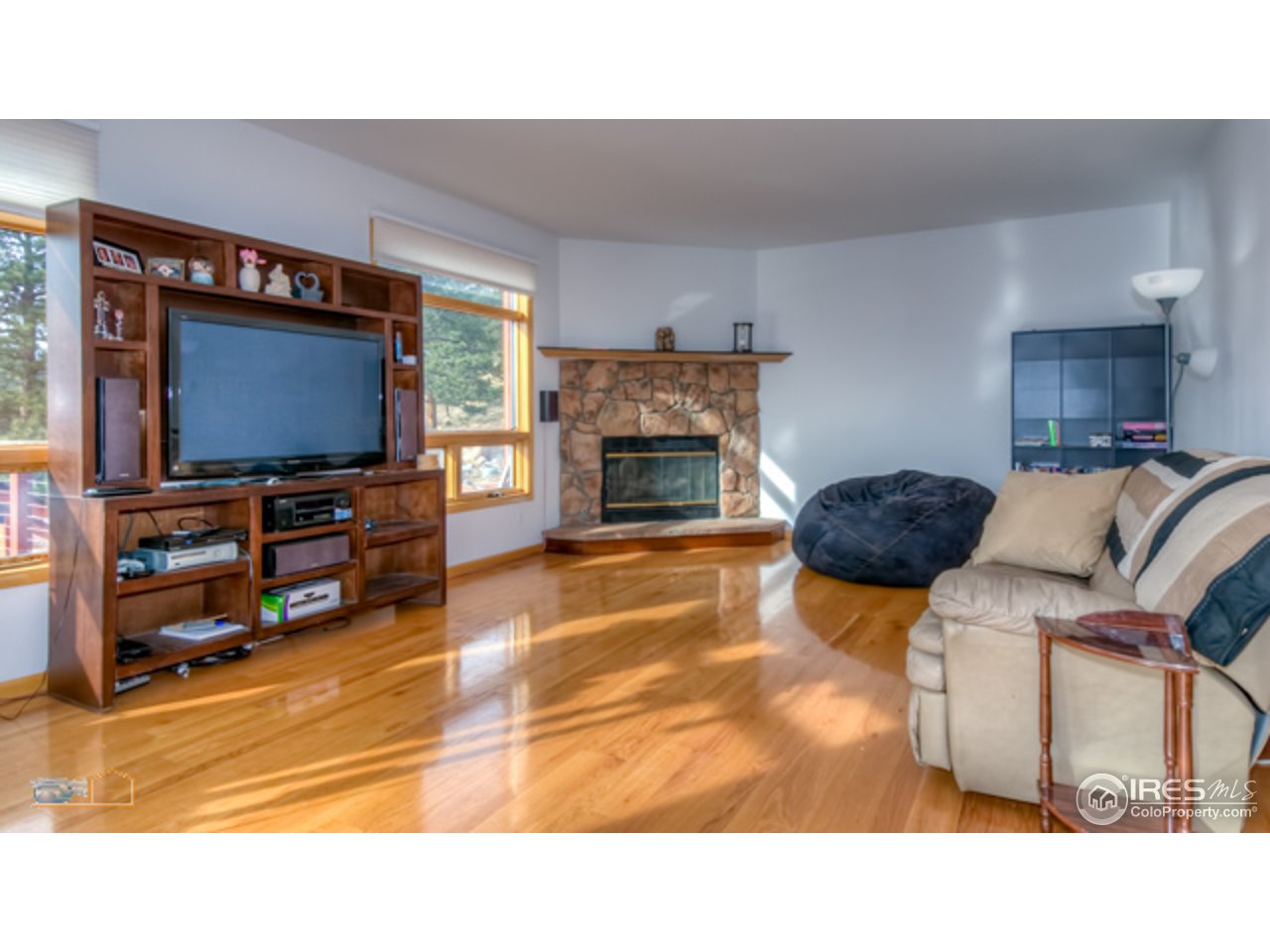 1385 West Coach Road Boulder, CO 80302 - Photo 9 of 25 a living room with furniture and a flat screen tv