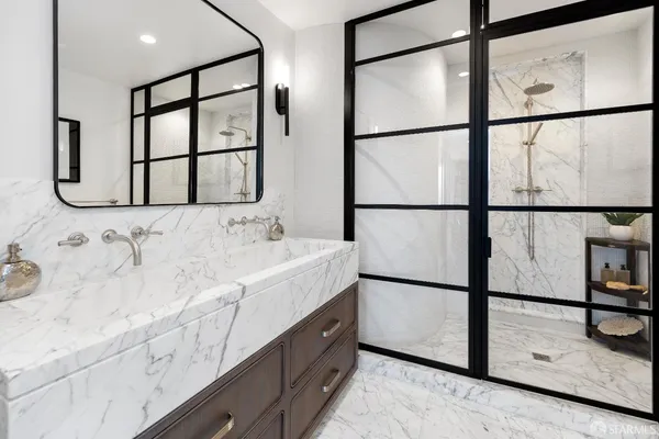 a spacious bathroom with a double vanity sink and a window