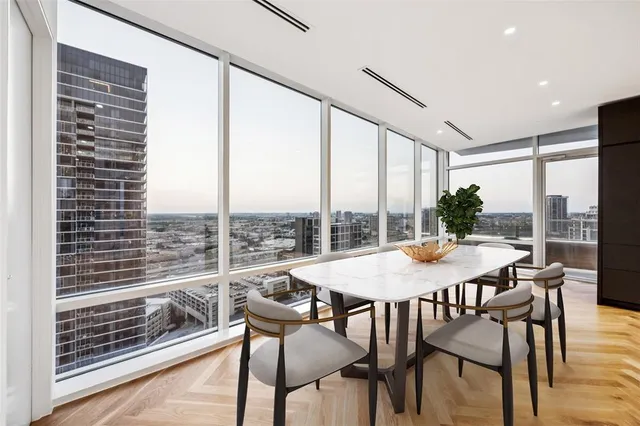 a view of a dining room with furniture window and wooden floor