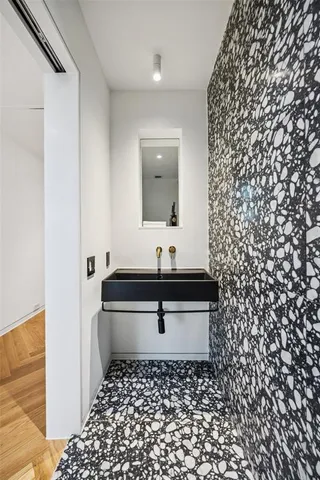 a bathroom with a sink and a mirror