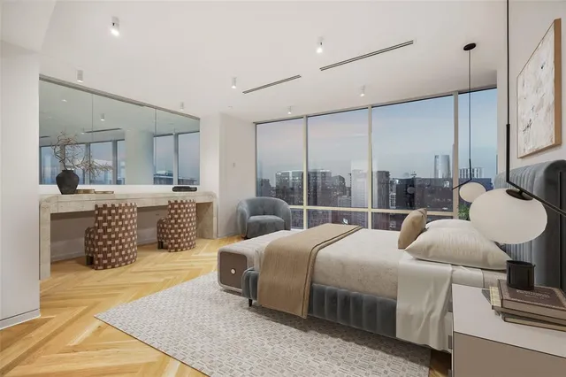 a bedroom with double bed and a large window