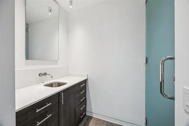 a bathroom with a sink and mirror