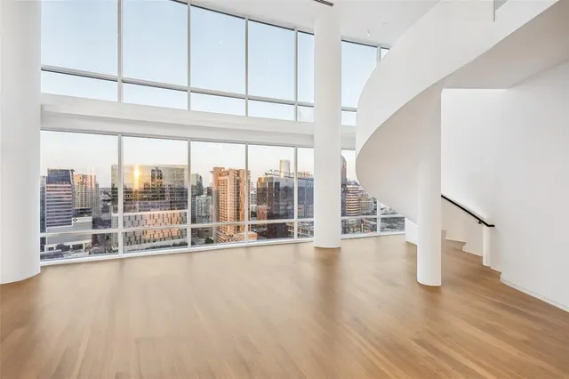 a view of an entryway with wooden floor