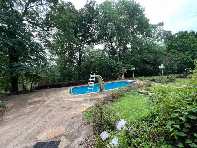 a view of a wooden deck with a backyard