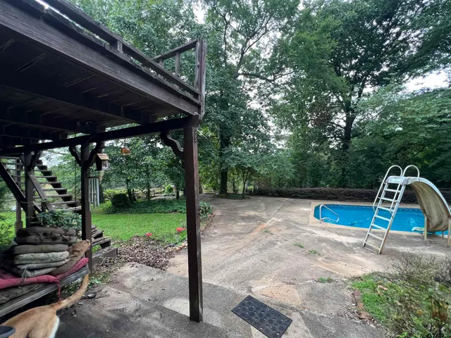 a backyard of a house with outdoor seating