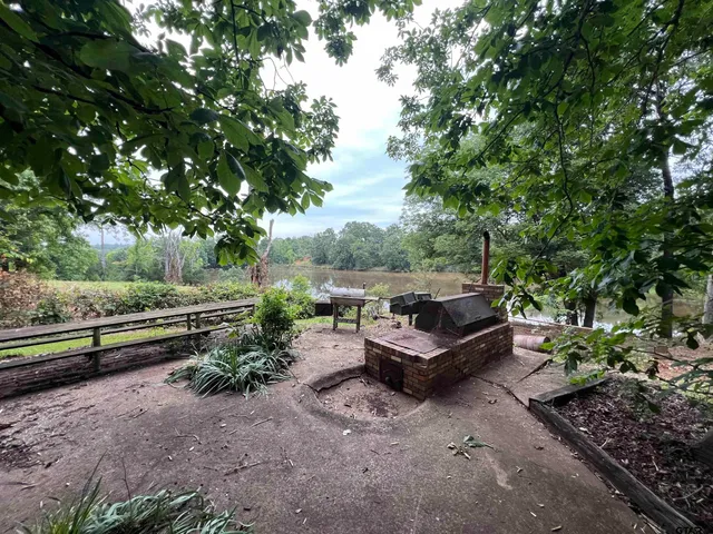 a view of a swimming pool with a patio