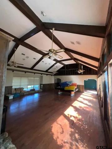 a view of a yard with large tree