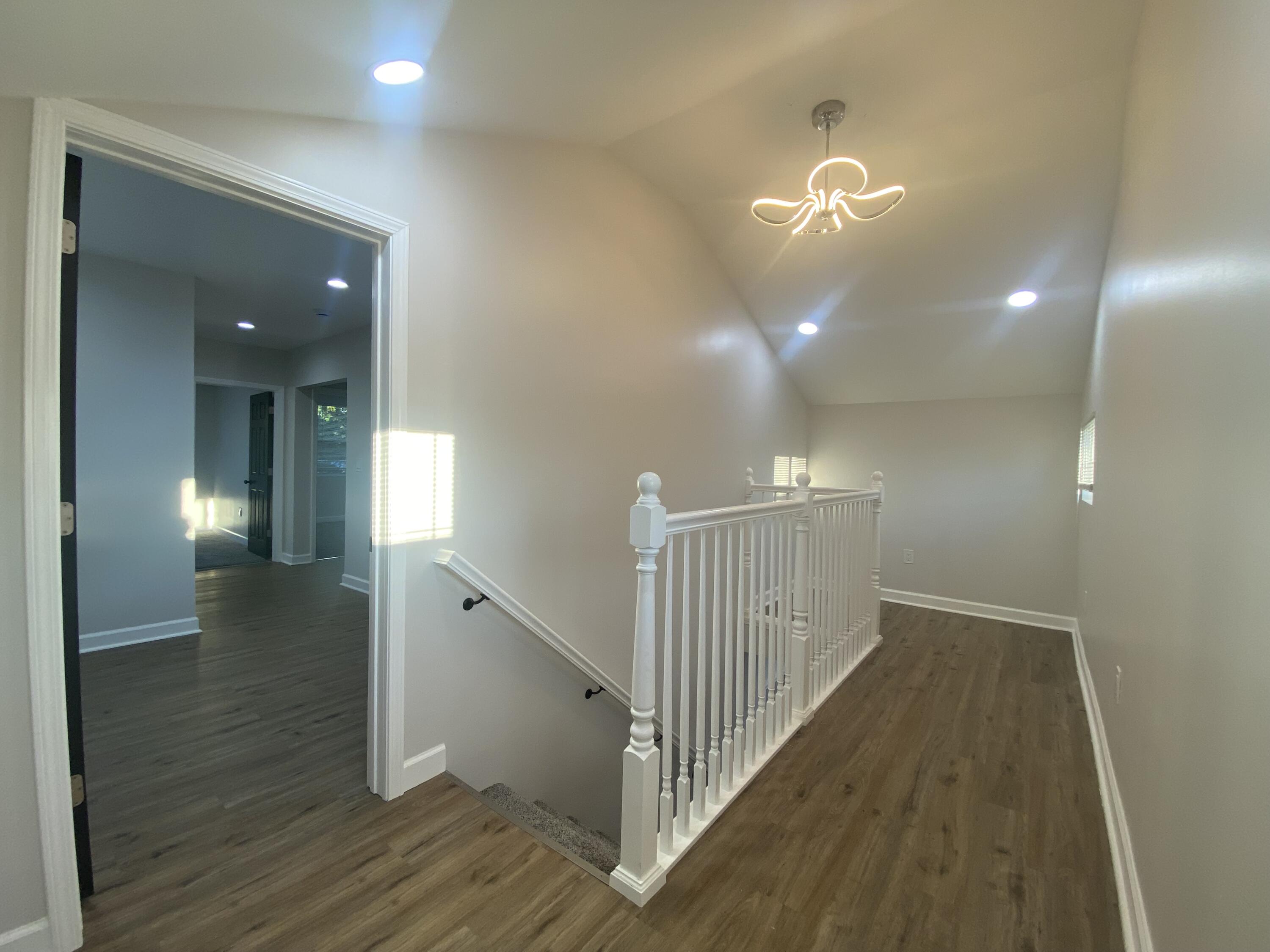 1165 Waite Street Gary, IN 46404 - Photo 12 of 18 a view of a hallway with wooden floor and stairs