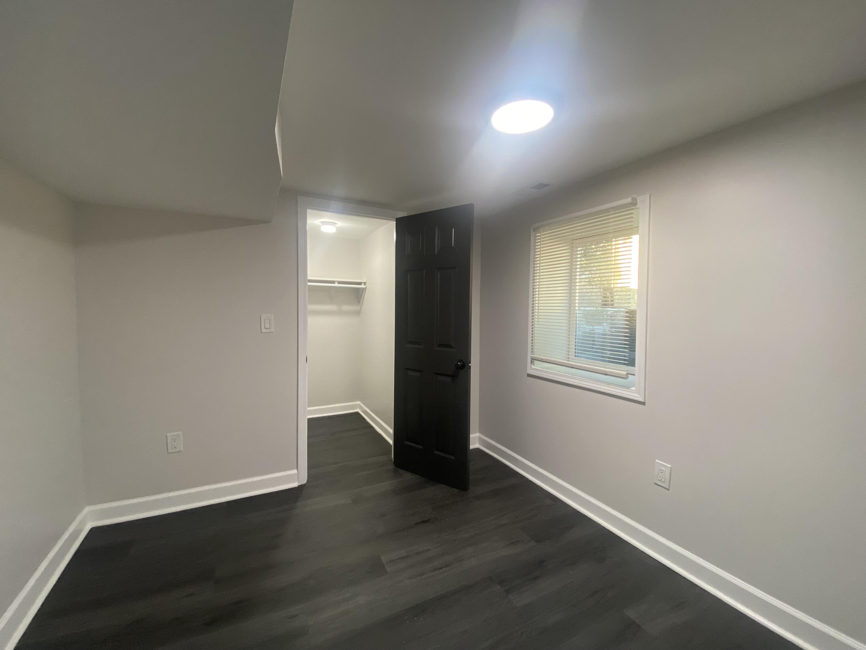1165 Waite Street Gary, IN 46404 - Photo 15 of 18 an empty room with wooden floor and window