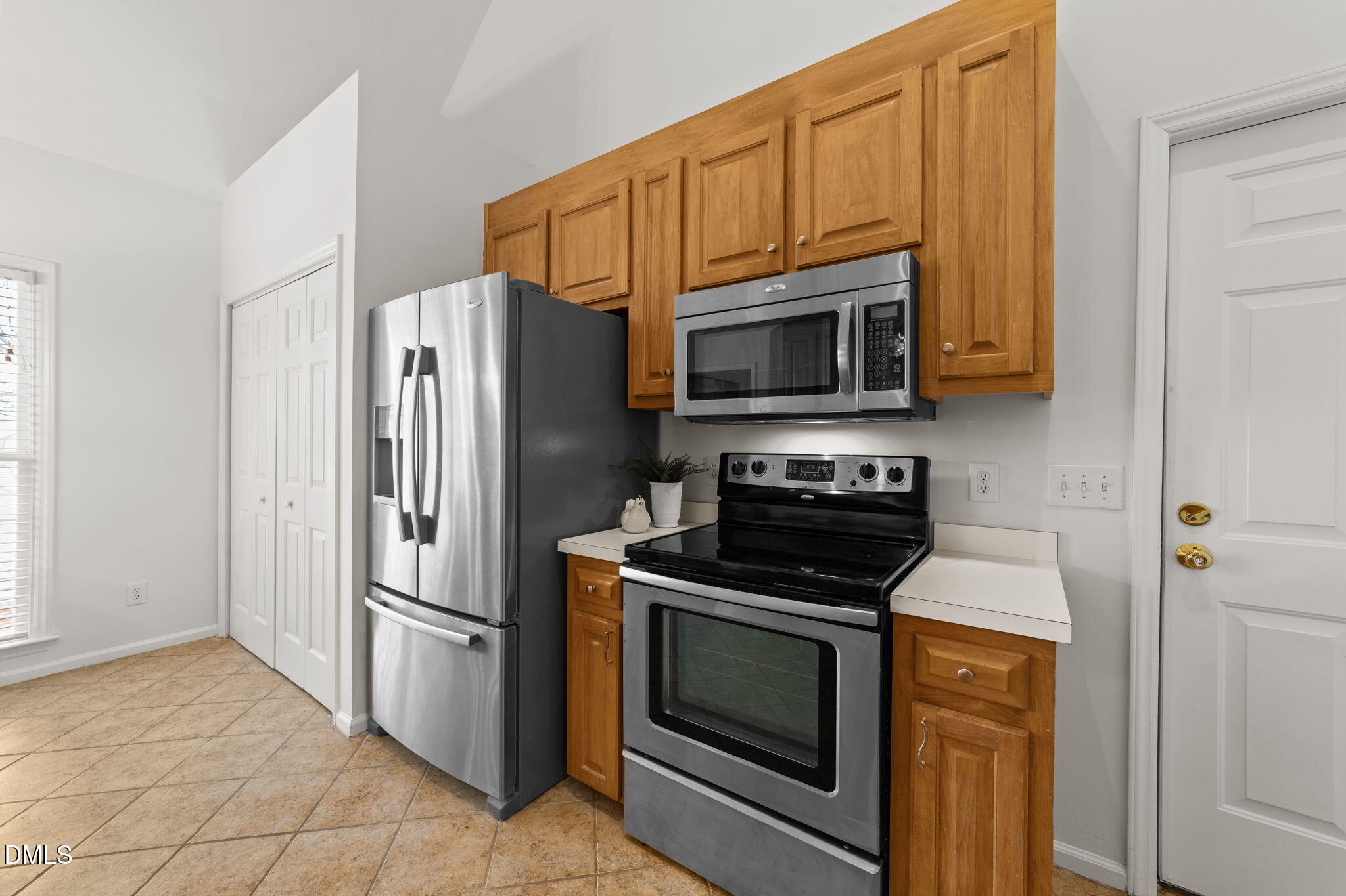 1641 Hall Boulevard Garner, NC 27529 - Photo 11 of 37 a kitchen with stainless steel appliances granite countertop a refrigerator stove and microwave