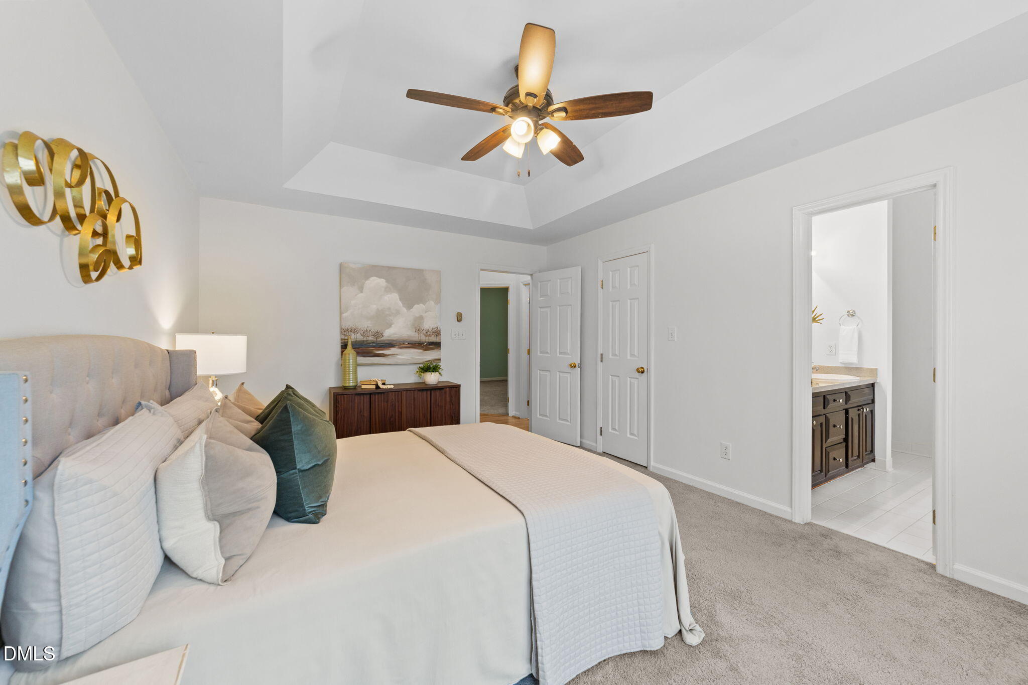 1641 Hall Boulevard Garner, NC 27529 - Photo 16 of 37 a bedroom with a bed and a ceiling fan
