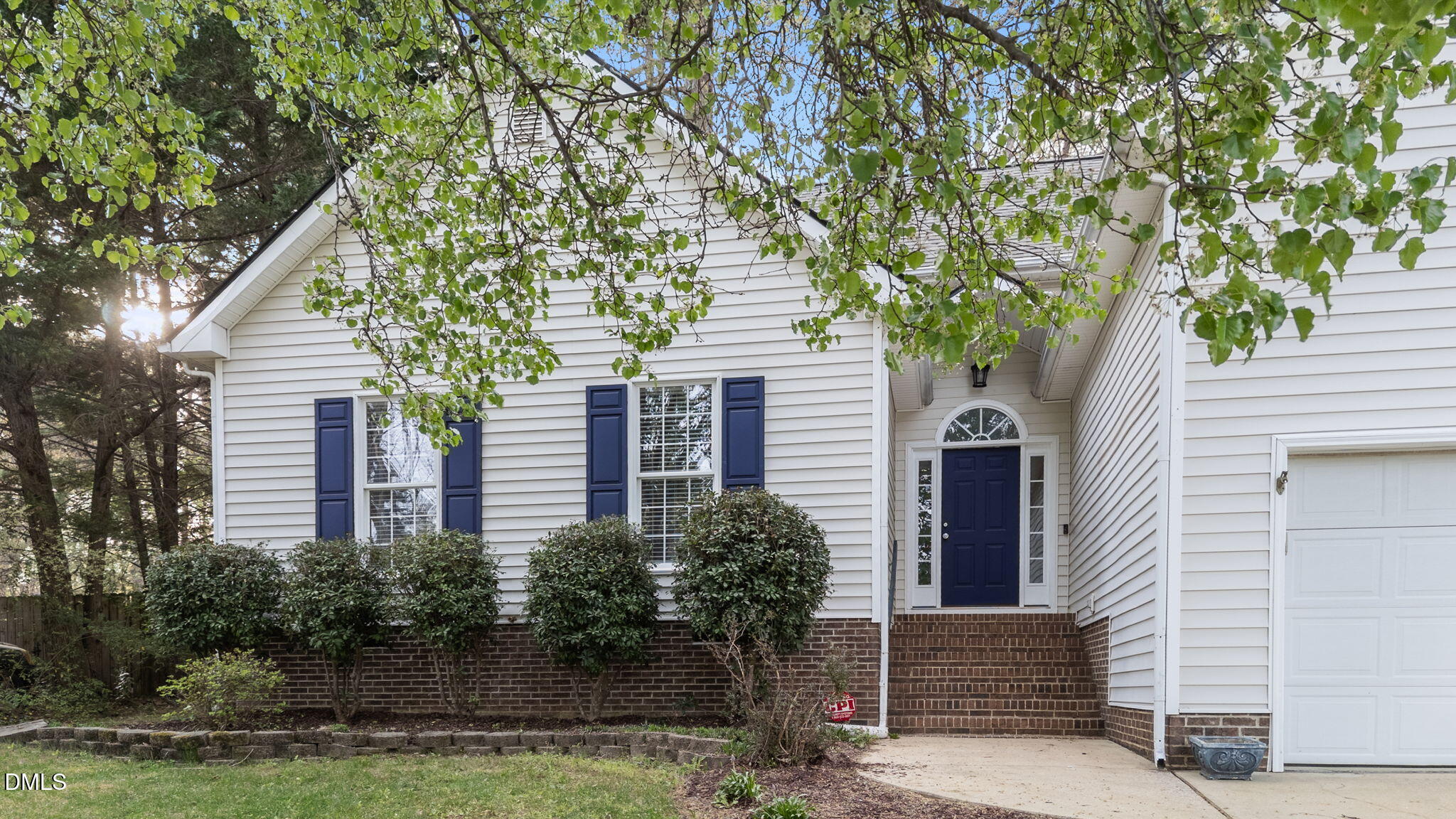 1641 Hall Boulevard Garner, NC 27529 - Photo 2 of 37 a front view of a house with plants and trees