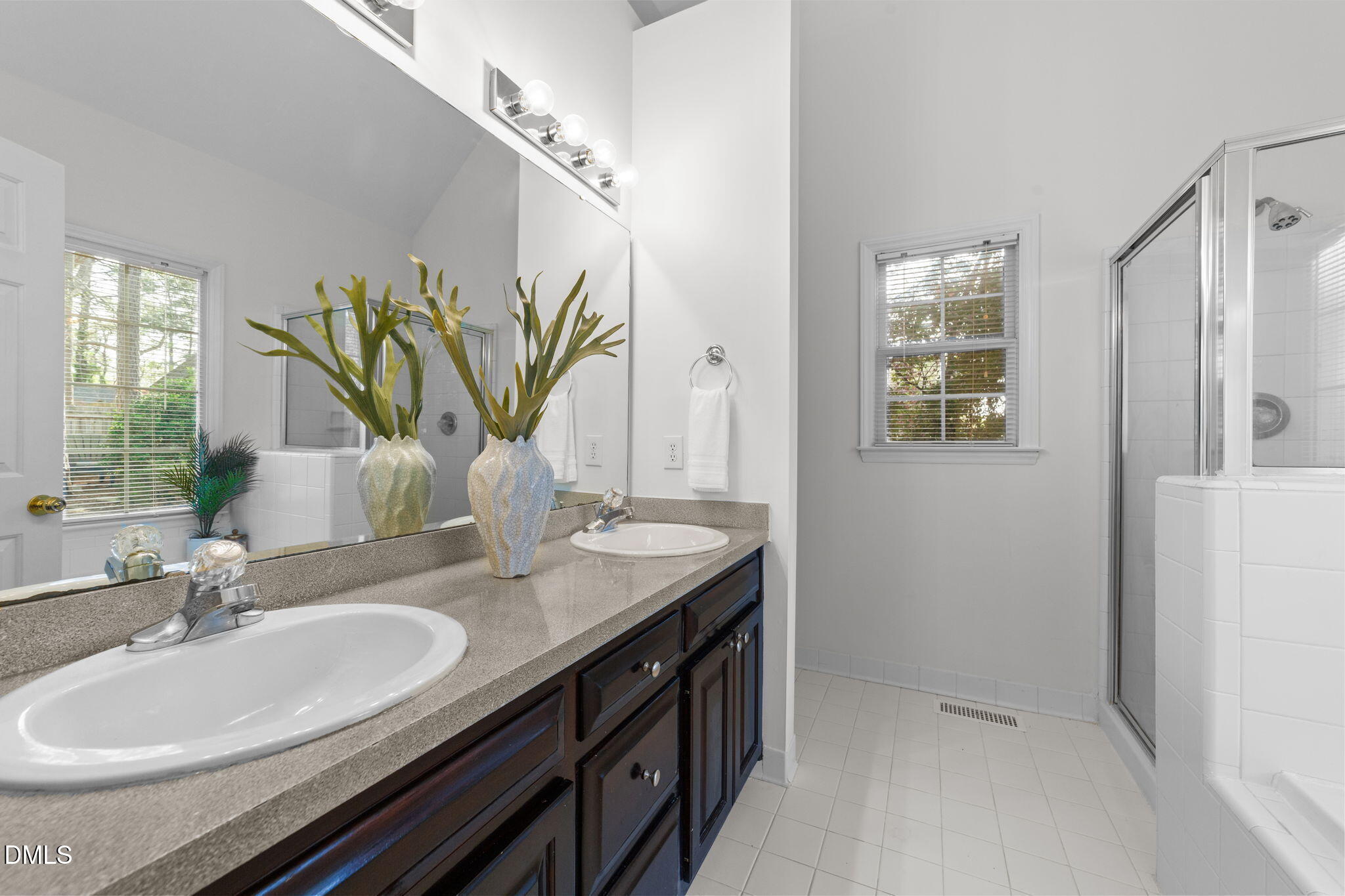 1641 Hall Boulevard Garner, NC 27529 - Photo 21 of 37 a bathroom with a granite countertop sink a mirror and a shower