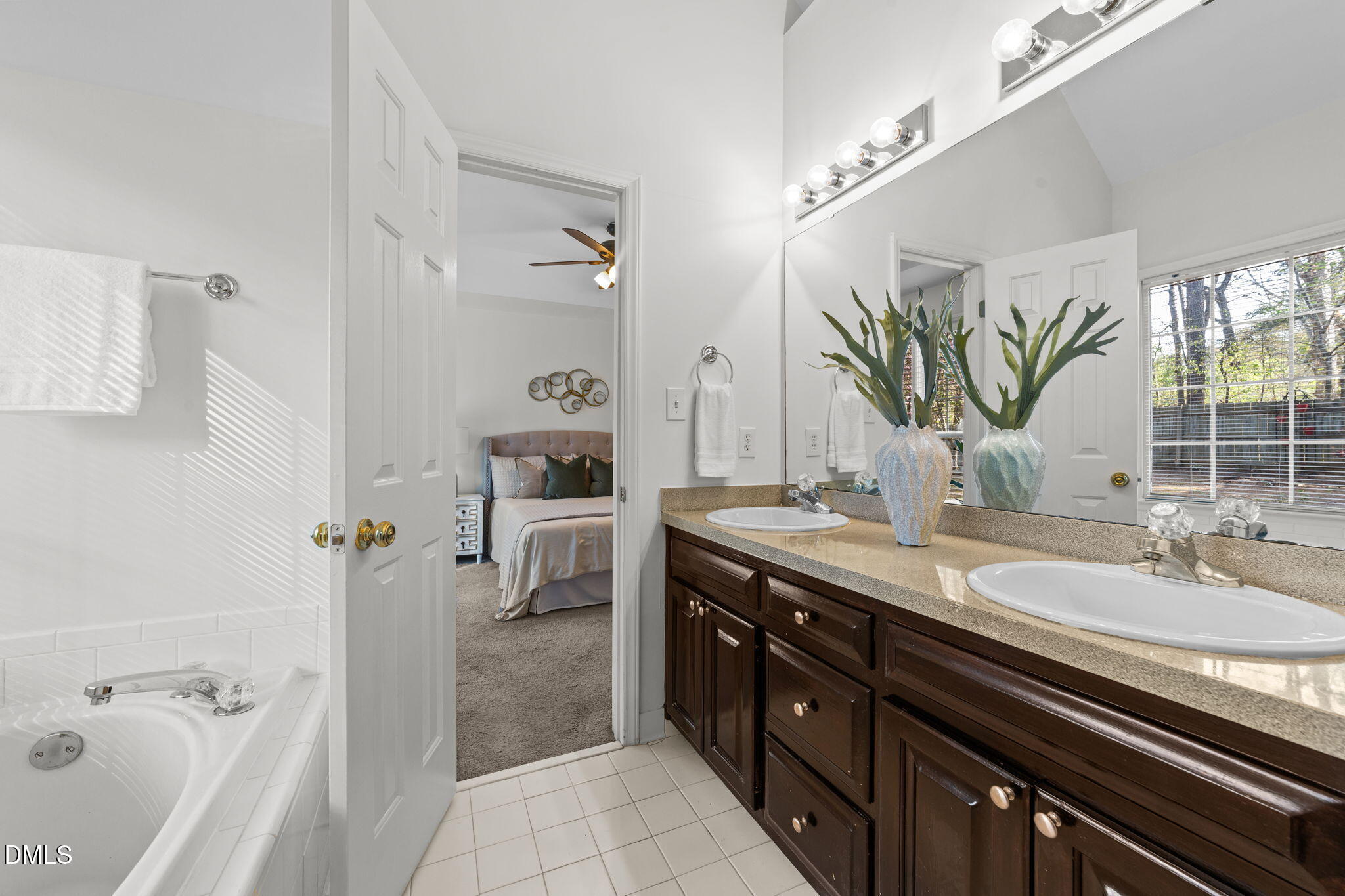 1641 Hall Boulevard Garner, NC 27529 - Photo 22 of 37 a spacious bathroom with a granite countertop sink a mirror and shower