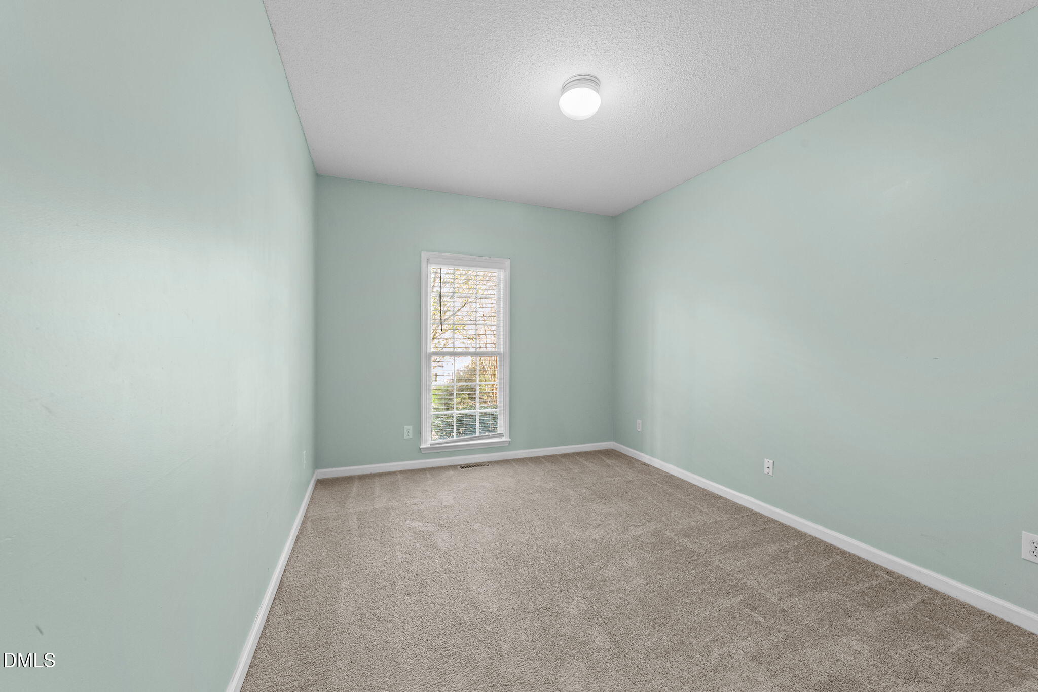 1641 Hall Boulevard Garner, NC 27529 - Photo 23 of 37 an empty room with a window