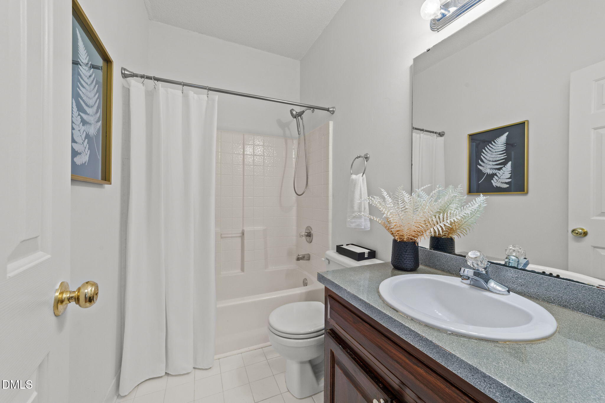 1641 Hall Boulevard Garner, NC 27529 - Photo 25 of 37 a bathroom with a granite countertop sink a toilet and a mirror