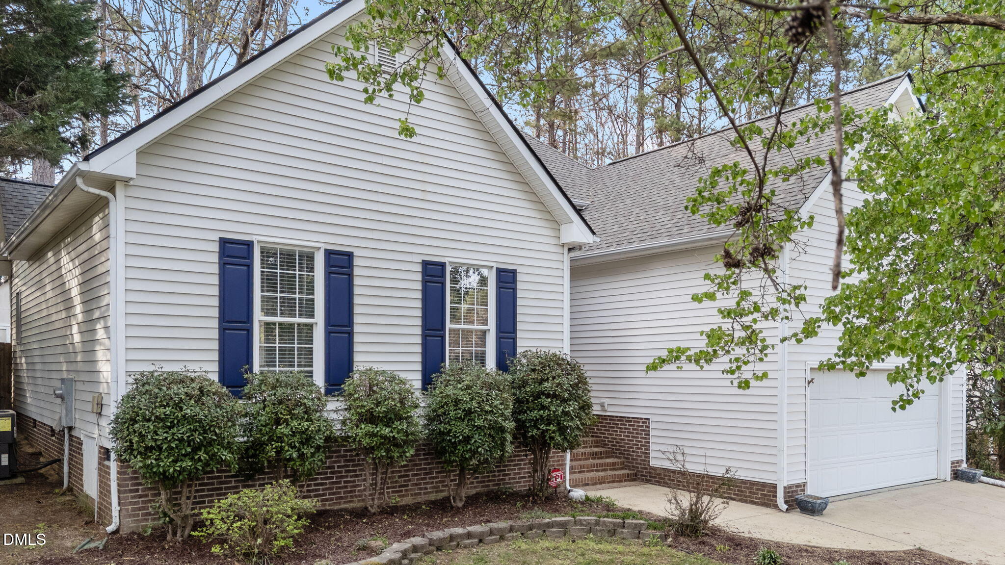 1641 Hall Boulevard Garner, NC 27529 - Photo 36 of 37 a front view of a house with plants