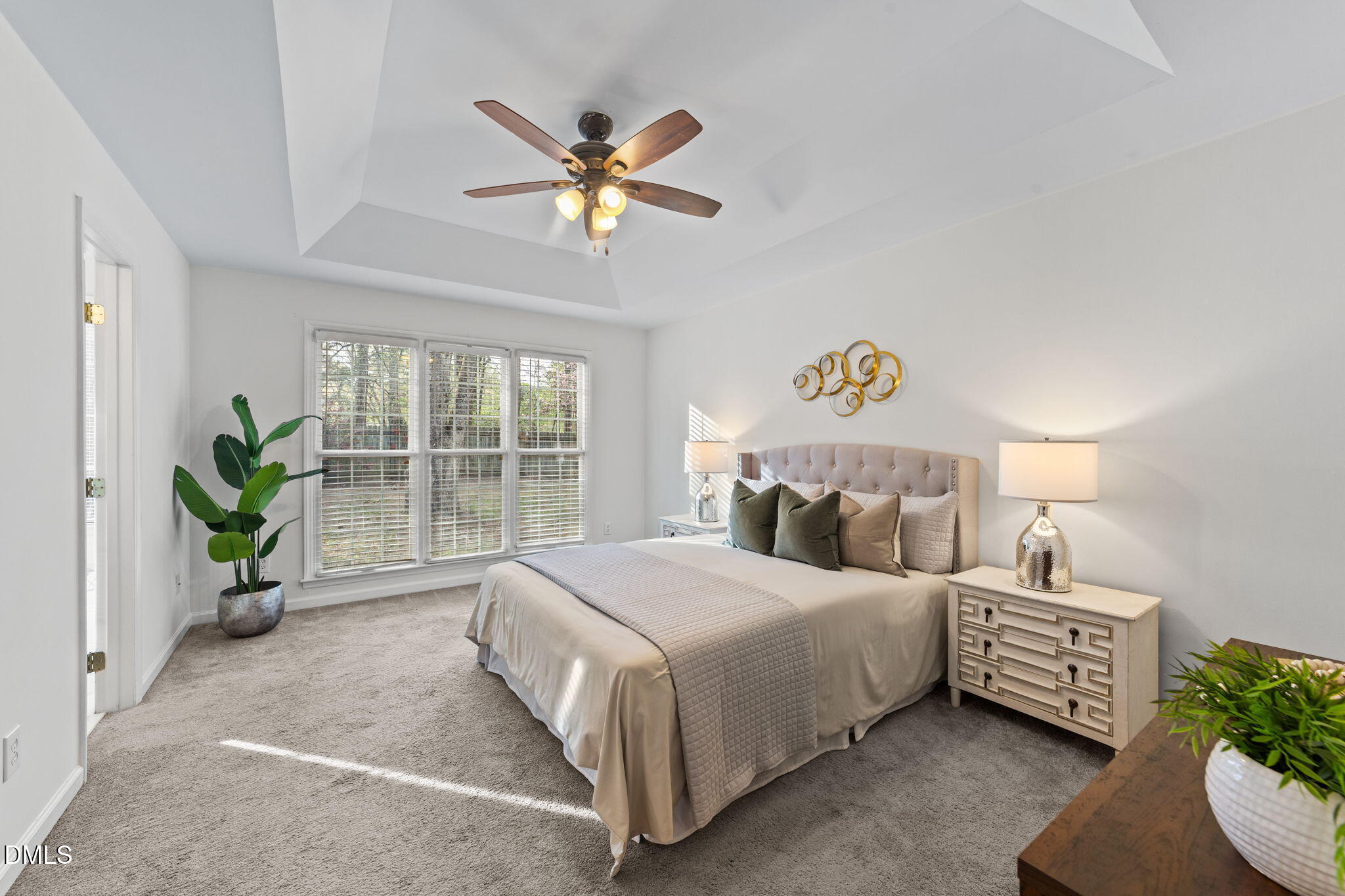 1641 Hall Boulevard Garner, NC 27529 - Photo 7 of 37 a bedroom with a bed and a chandelier