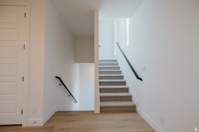 2759 Becco Trail, Unit 16 St. George, UT 84770 - Photo 42 of 42 Stairway featuring wood finished floors and baseboards