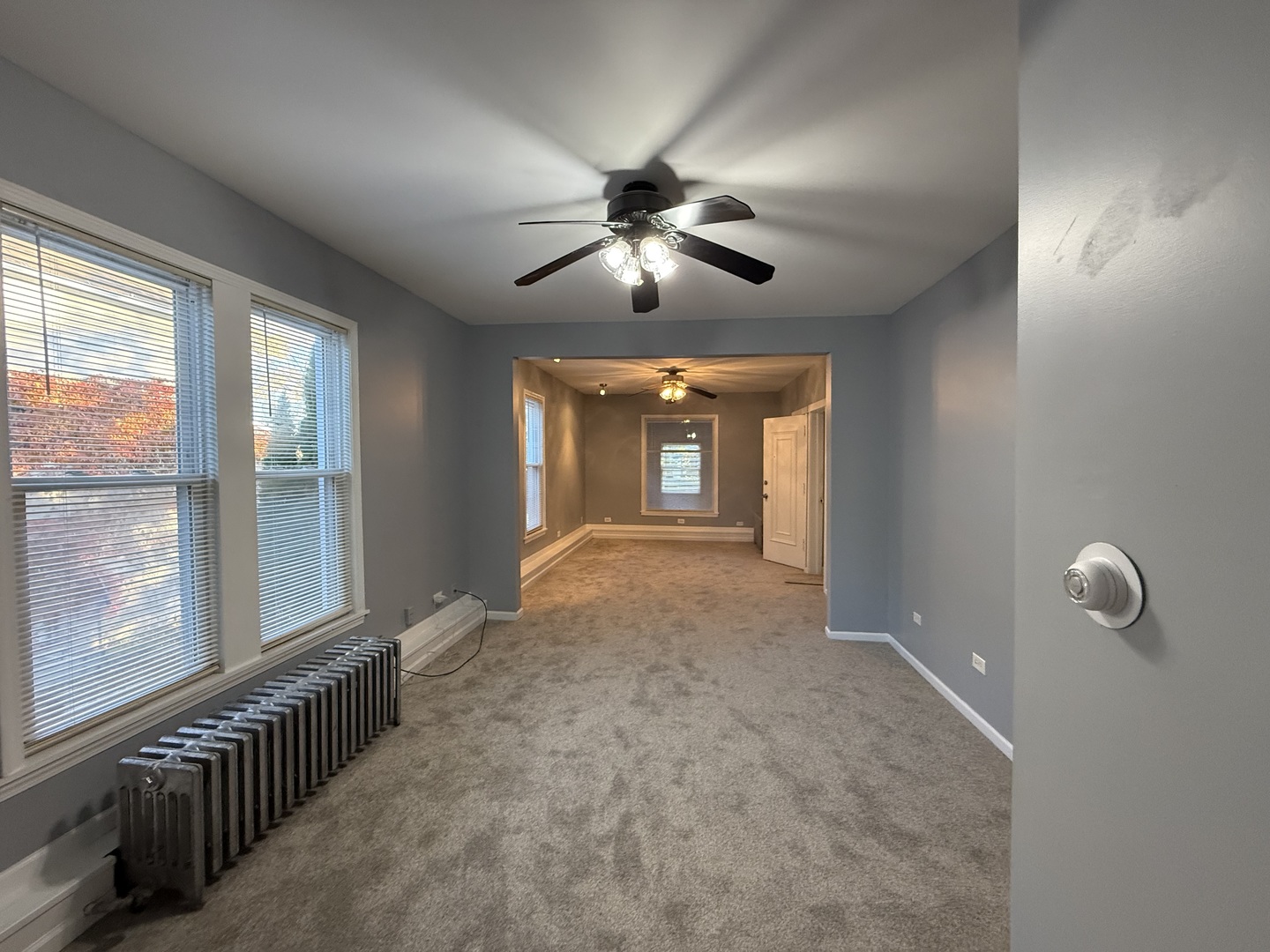 1723 Emerson Street, Unit 1 Evanston, IL 60201 - Photo 14 of 18 a view of a livingroom with a chandelier fan and windows