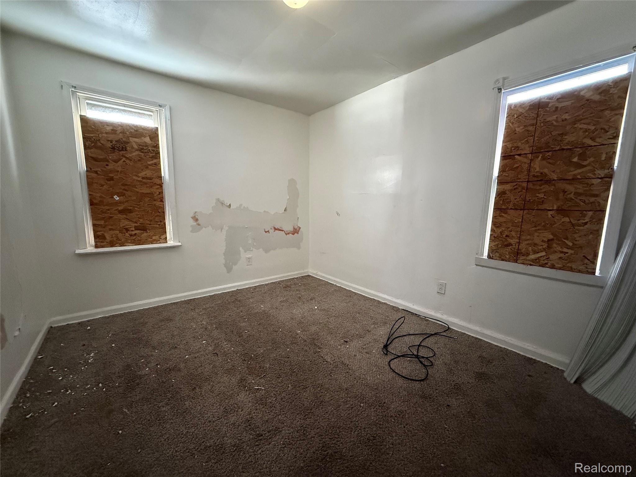 8864 Heyden Detroit, MI 48228 - Photo 9 of 16 Unfurnished room with carpet flooring and baseboards