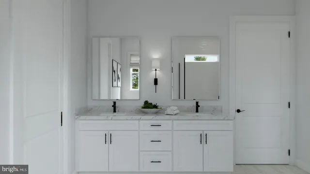 a bathroom with double sink and a mirror