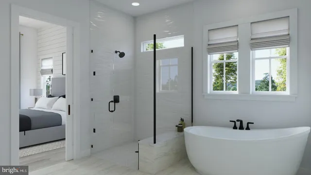 a bathroom with a tub a sink and mirror