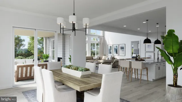 a view of a dining room and livingroom with furniture wooden floor a chandelier