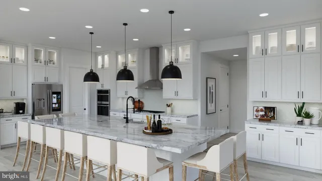 a kitchen with stainless steel appliances kitchen island granite countertop a sink and cabinets