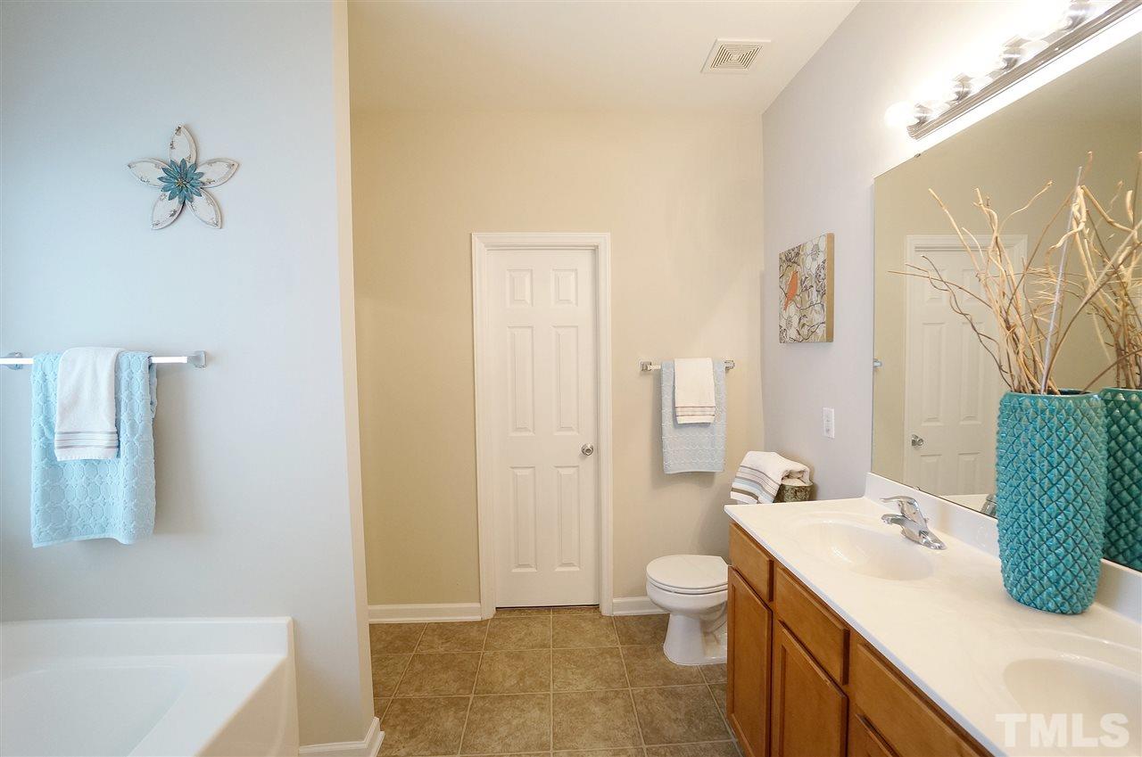 5109 Chasteal Trail Raleigh, NC 27610 - Photo 13 of 25 Dual vanities for added personal space. Separate shower for added convenience. Large WIC.