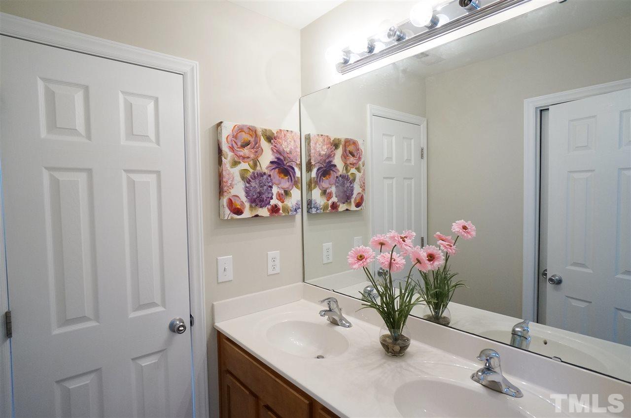 5109 Chasteal Trail Raleigh, NC 27610 - Photo 17 of 25 Jack & Jill bathroom has dual vanities for added personal space & separate shower.