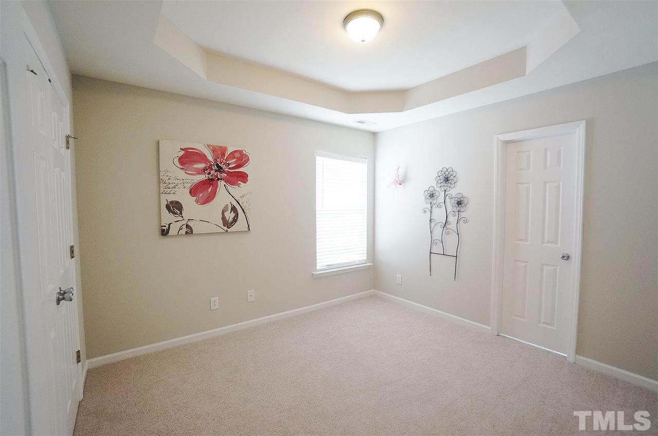 5109 Chasteal Trail Raleigh, NC 27610 - Photo 18 of 25 Spacious & versatile bedroom has stylish trey ceiling, large closet and Jack & Jill bathroom.