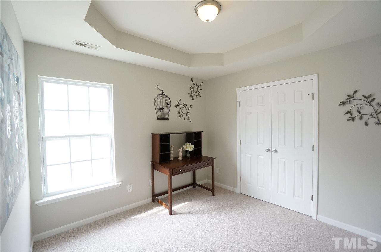 5109 Chasteal Trail Raleigh, NC 27610 - Photo 19 of 25 Spacious & versatile bedroom has stylish trey ceiling & large closet.