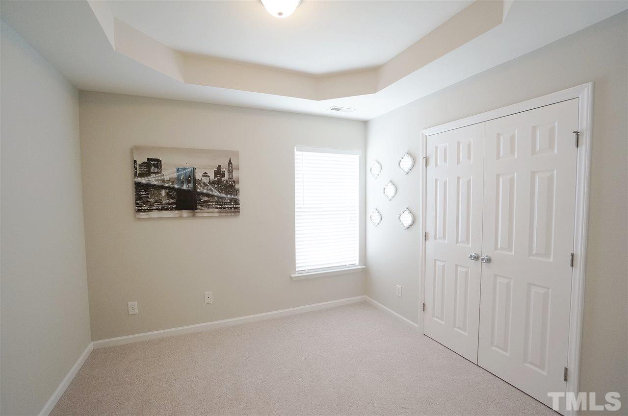 5109 Chasteal Trail Raleigh, NC 27610 - Photo 20 of 25 Spacious & versatile bedroom has stylish trey ceiling & large closet.