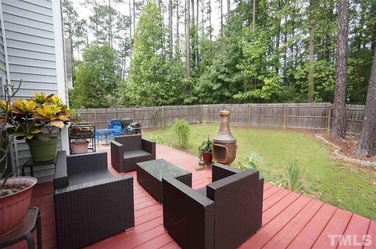 5109 Chasteal Trail Raleigh, NC 27610 - Photo 24 of 25 Back deck looks out over large, privacy fenced back yard.