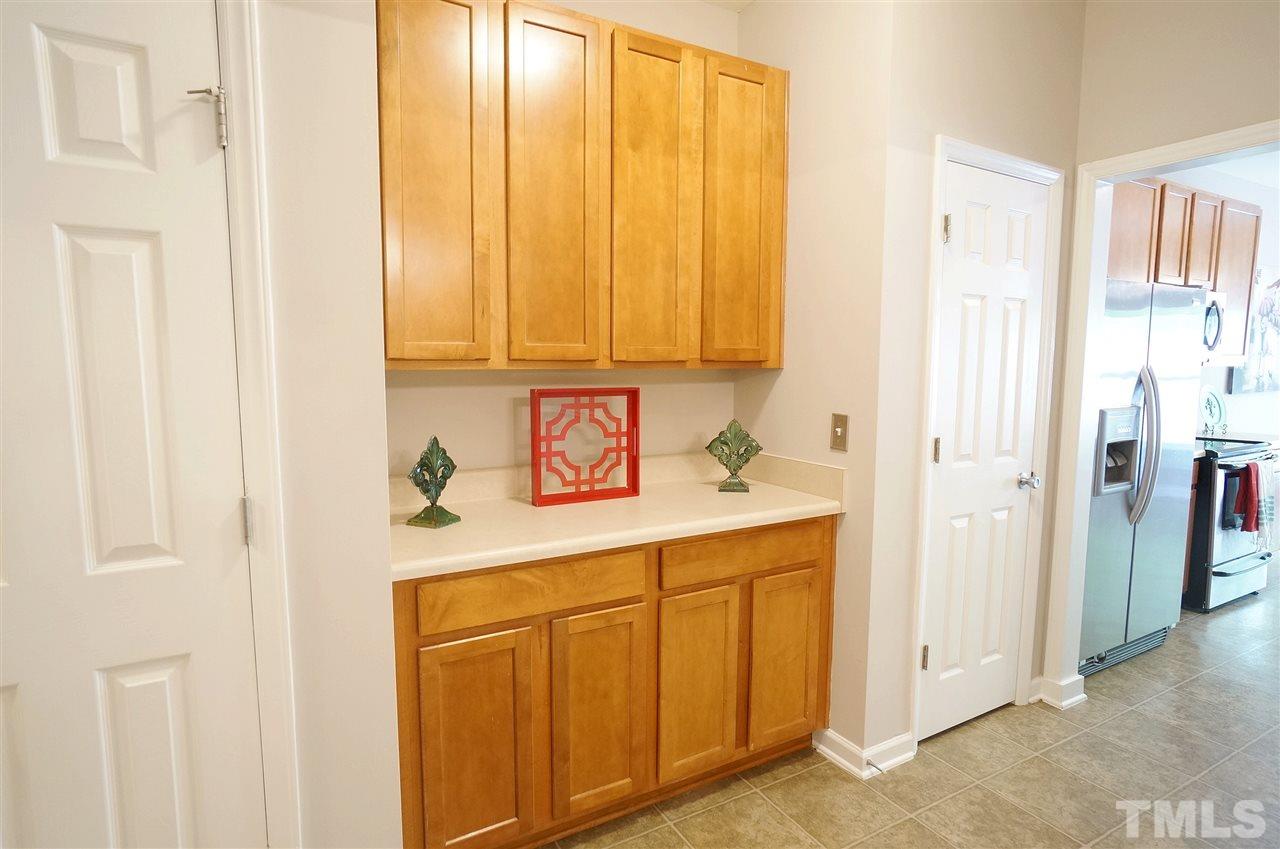 5109 Chasteal Trail Raleigh, NC 27610 - Photo 4 of 25 Galley way offers additional space, storage and a lovely segue to the kitchen.
